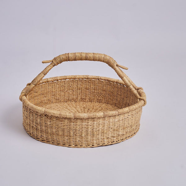 Beautiful basket with handle that is handmade by woven worldwide.